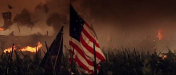 Movie still from “Cold Mountain” (2003), directed by Anthony Minghella – A group of american flags blowing in the wind; Extreme Wide shot, Low angle