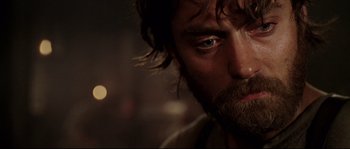 Movie still from “Cold Mountain” (2003), directed by Anthony Minghella – A person with a beard; Close Up shot, Over the shoulder angle