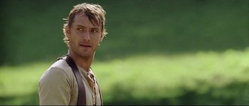 Movie still from “Cold Mountain” (2003), directed by Anthony Minghella – A person wearing a vest and a tie; Close Up shot, Over the shoulder angle