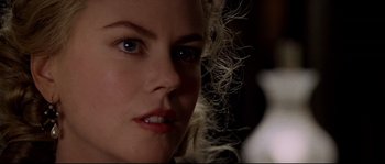 Movie still from “Cold Mountain” (2003), directed by Anthony Minghella – A woman's face with white hair and blue eyes; Close Up shot, Over the shoulder angle
