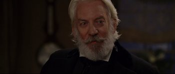 Movie still from “Cold Mountain” (2003), directed by Anthony Minghella – An older man with white hair wearing a black suit; Close Up shot, Low angle