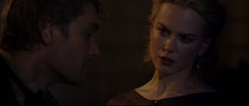Movie still from “Cold Mountain” (2003), directed by Anthony Minghella – A man and a woman standing next to each other in the dark; Close Up shot, Over the shoulder angle