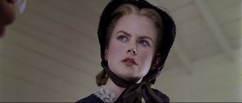 Movie still from “Cold Mountain” (2003), directed by Anthony Minghella – A person wearing a hat; Close Up shot, Low angle