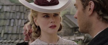 Movie still from “Cold Mountain” (2003), directed by Anthony Minghella – A person wearing a hat; Close Up shot, Over the shoulder angle