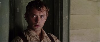 Movie still from “Cold Mountain” (2003), directed by Anthony Minghella – A person wearing a brown shirt; Close Up shot, Over the shoulder angle