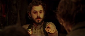 Movie still from “Cold Mountain” (2003), directed by Anthony Minghella – A man with a beard is pointing at something; Close Up shot, Over the shoulder angle