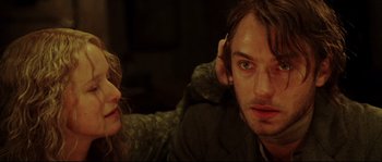 Movie still from “Cold Mountain” (2003), directed by Anthony Minghella – A man and a woman sitting next to each other; Close Up shot, Over the shoulder angle