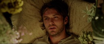 Movie still from “Cold Mountain” (2003), directed by Anthony Minghella – A person laying in a bed; Close Up shot, Overhead angle