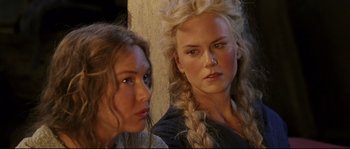 Movie still from “Cold Mountain” (2003), directed by Anthony Minghella – Two young women standing next to each other in front of a wall; Close Up shot, Over the shoulder angle