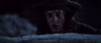 Movie still from “Cold Mountain” (2003), directed by Anthony Minghella – A man with a hat looking at the camera; Close Up shot, Low angle
