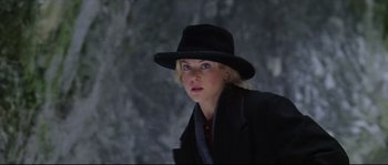 Movie still from “Cold Mountain” (2003), directed by Anthony Minghella – A woman wearing a black hat and a black coat; Close Up shot, Low angle