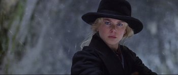 Movie still from “Cold Mountain” (2003), directed by Anthony Minghella – A woman wearing a black hat and a black coat; Close Up shot, Low angle