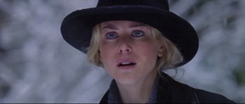 Movie still from “Cold Mountain” (2003), directed by Anthony Minghella – A person wearing a hat; Close Up shot, Over the shoulder angle