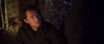 Movie still from “Cold Mountain” (2003), directed by Anthony Minghella – A person wearing a jacket; Close Up shot, Over the shoulder angle