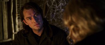 Movie still from “Cold Mountain” (2003), directed by Anthony Minghella – A person looking at the camera; Close Up shot, Over the shoulder angle