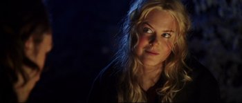 Movie still from “Cold Mountain” (2003), directed by Anthony Minghella – A woman with long blonde hair stares into the camera; Close Up shot, Over the shoulder angle