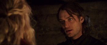 Movie still from “Cold Mountain” (2003), directed by Anthony Minghella – A person with long brown hair; Close Up shot, Over the shoulder angle