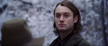 Movie still from “Cold Mountain” (2003), directed by Anthony Minghella – A person with long brown hair; Close Up shot, Over the shoulder angle