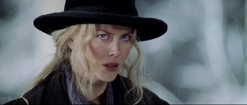 Movie still from “Cold Mountain” (2003), directed by Anthony Minghella – A person wearing a hat; Close Up shot, Over the shoulder angle