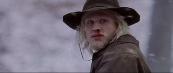 Movie still from “Cold Mountain” (2003), directed by Anthony Minghella – A person wearing a hat; Close Up shot, Low angle