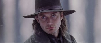 Movie still from “Cold Mountain” (2003), directed by Anthony Minghella – A person wearing a hat; Close Up shot, Low angle