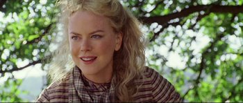 Movie still from “Cold Mountain” (2003), directed by Anthony Minghella – A person wearing a plaid shirt; Close Up shot, Over the shoulder angle