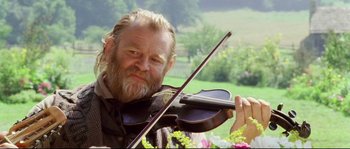 Movie still from “Cold Mountain” (2003), directed by Anthony Minghella – A person holding a violin; Close Up shot, Low angle