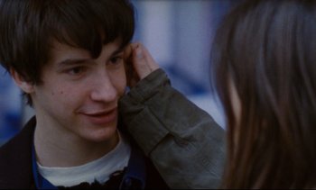 Movie still from “Cold Water” (1994), directed by Olivier Assayas – A young man and a young woman looking into each others eyes; Close Up shot, Over the shoulder angle