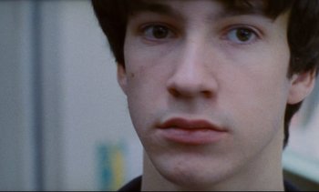 Movie still from “Cold Water” (1994), directed by Olivier Assayas – A young man's face; Extreme Close Up shot, Overhead angle