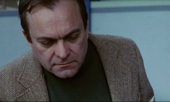 Movie still from “Cold Water” (1994), directed by Olivier Assayas – A person wearing a jacket; Close Up shot, High angle