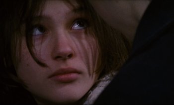Movie still from “Cold Water” (1994), directed by Olivier Assayas – A young woman's face; Close Up shot, Over the shoulder angle