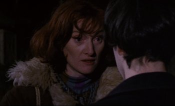Movie still from “Cold Water” (1994), directed by Olivier Assayas – A woman in a fur coat talking to a man in a black shirt; Close Up shot, Over the shoulder angle