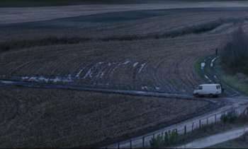 Movie still from “Cold Water” (1994), directed by Olivier Assayas – An aerial view of an empty field at night; Extreme Wide shot, High angle