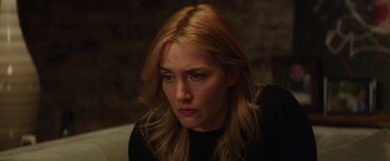 Movie still from “Collateral Beauty” (2016), directed by David Frankel – A person with long blonde hair; Close Up shot, Over the shoulder angle