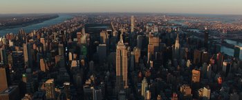 Movie still from “Collateral Beauty” (2016), directed by David Frankel – An aerial view of a large city with skyscrapers; Extreme Wide shot, High angle