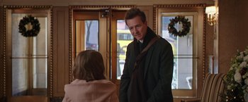 Movie still from “Collateral Beauty” (2016), directed by David Frankel – A man and a woman are standing in front of a window; Medium shot, Over the shoulder angle
