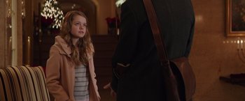 Movie still from “Collateral Beauty” (2016), directed by David Frankel – A young girl standing in front of an older man; Medium shot, Over the shoulder angle
