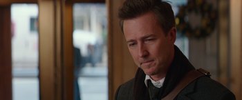 Movie still from “Collateral Beauty” (2016), directed by David Frankel – A person wearing a jacket and a scarf; Close Up shot, Over the shoulder angle