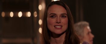 Movie still from “Collateral Beauty” (2016), directed by David Frankel – A person with long brown hair; Close Up shot, Over the shoulder angle