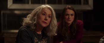 Movie still from “Collateral Beauty” (2016), directed by David Frankel – Two women sitting next to each other in front of a window; Close Up shot, Over the shoulder angle