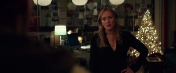 Movie still from “Collateral Beauty” (2016), directed by David Frankel – A woman standing in front of a wall with papers on the wall; Medium shot, Over the shoulder angle