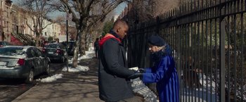 Movie still from “Collateral Beauty” (2016), directed by David Frankel – A man and a woman holding hands on a sidewalk; Medium shot, Over the shoulder angle