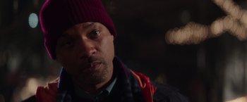 Movie still from “Collateral Beauty” (2016), directed by David Frankel – A person wearing a hat; Close Up shot, Over the shoulder angle