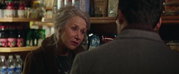 Movie still from “Collateral Beauty” (2016), directed by David Frankel – An older woman sitting in front of a young man; Close Up shot, Over the shoulder angle