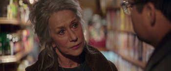 Movie still from “Collateral Beauty” (2016), directed by David Frankel – An older woman is looking into the distance; Close Up shot, Over the shoulder angle