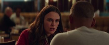 Movie still from “Collateral Beauty” (2016), directed by David Frankel – A young woman sitting in front of another man; Close Up shot, Over the shoulder angle