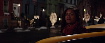 Movie still from “Collateral Beauty” (2016), directed by David Frankel – A woman sitting in a car on the side of the street; Close Up shot, Over the shoulder angle