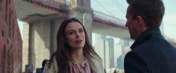 Movie still from “Collateral Beauty” (2016), directed by David Frankel – A beautiful young woman standing next to a bridge; Close Up shot, Over the shoulder angle
