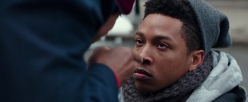 Movie still from “Collateral Beauty” (2016), directed by David Frankel – A man is getting his nose brushed by another man; Close Up shot, Over the shoulder angle