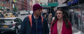 Movie still from “Collateral Beauty” (2016), directed by David Frankel – A man and a woman walking down a street; Medium shot, Over the shoulder angle